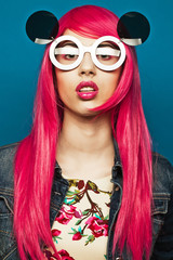 Fototapeta premium Beautiful fashion model with pink hair
