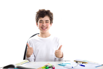 Caucasian smooth-skinned boy showing success thumbs up on homewo