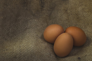 Eggs on sackcloth background