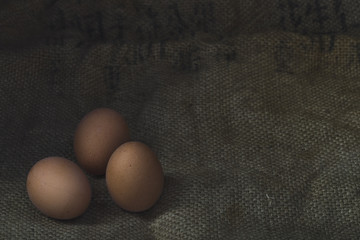 Eggs on sackcloth background