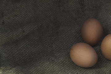 Eggs on sackcloth background