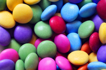 Macro detail of pile of colored smarties