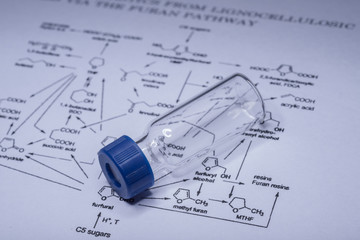 Sample vial on the paper of chemical formula