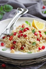 Quinoa salad with chickpea and pomegranate.Healthy eating.