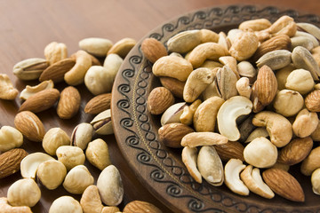 Mix nuts in wooden plate