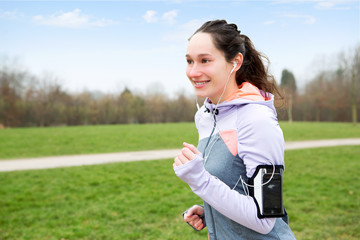 Young attractive woman running at the park