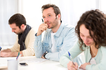 Obraz premium Young attractive student during classes