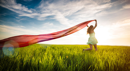 Young happy woman in wheat field with fabric. Summer lifestyle © mr.markin