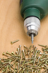 Electric drill with screws