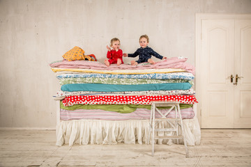 Children on the bed - Princess and the Pea.