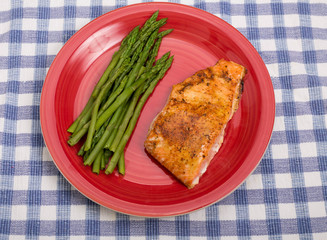 Baked Salmon and Asparagus on Red Plate