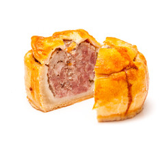 Pork pie isolated on a white studio background.