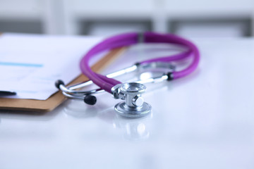 Doctor's stethoscope  with folder on the desk