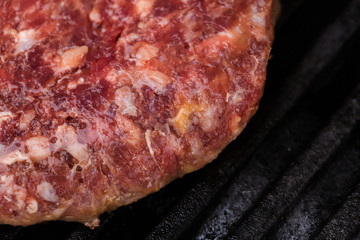 Preparing a batch of  grilled ground beef patties or frikadeller