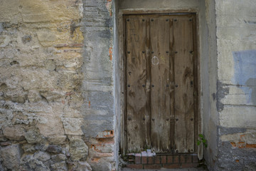 Vintage, medieval door Spanish city of Segovia. Old wooden entra