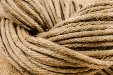 close up roll of rope on sack cloth,burlap