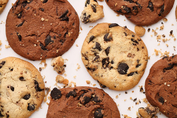 delicious cookies with chocolate on a white table