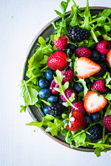 Green salad with arugula and berries