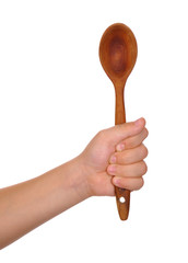 Wooden spoon in baby hand