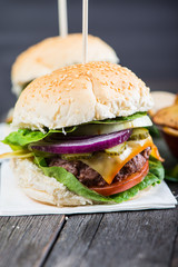 traditional pub style burger  on wooden table