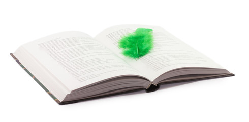 open book and feather isolated on white background