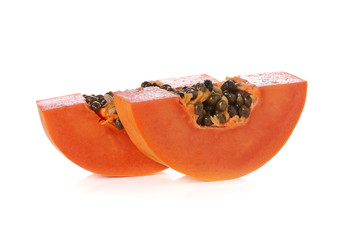 sliced papaya on a white background