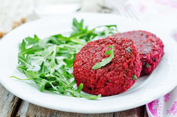 chickpeas, quinoa and beet burgers with arugula