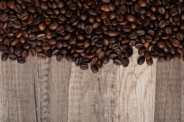 coffee beans on an old wooden background