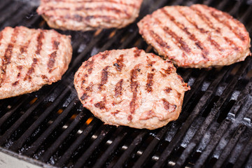 Preparing a batch of  grilled ground beef patties or frikadeller