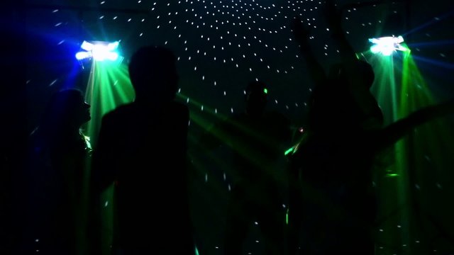 pair dancers dancing in spotlight at the club, silhouette, sexy