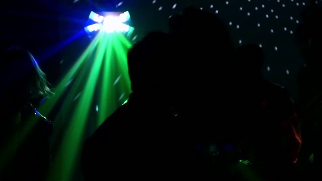 pair dancers dancing in spotlight at the club, silhouette, sexy
