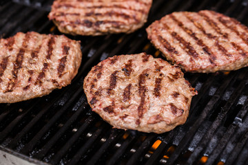 Preparing a batch of  grilled ground beef patties or frikadeller