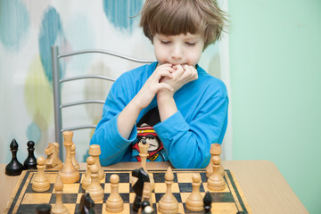 Boy playing chess
