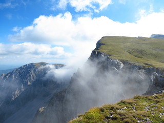 top Australian Alps, clouds flowing over the top