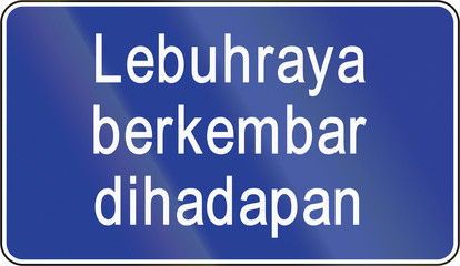 Road sign in Brunei: Lebuhraya berkembar dihadapan/Dual-Carriageway Highway Ahead