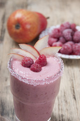 Fruit - berry smoothies with  pear and raspberries with yogurt .