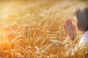 Woman pray for a rich harvest