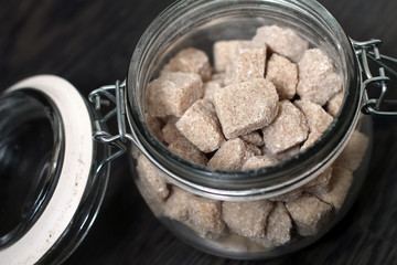 Brown sugar cubes at jar
