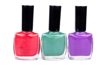 Three multi-colored nail polish