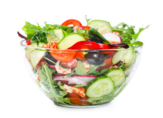 Salad with fresh vegetables, olives and shrimp isolated on white