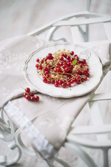 Red, white, currants on the plate
