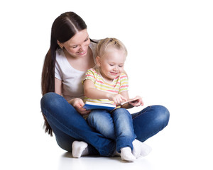 happy mother and child read a book together