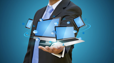 Businessman holding tech device in his hand