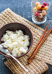 cottage cheese in an earthenware dish, shelves cinnamon, cup ras