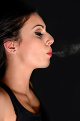 Fototapeta premium Smoking woman with a cigarette