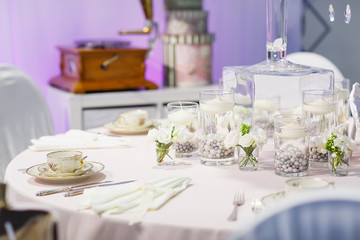 Elegant table set in green and white for wedding or event party.