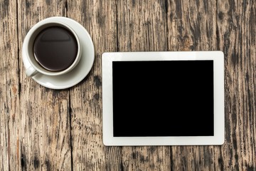Cup. Mobile workplace with tablet PC, phone and cup of coffee on