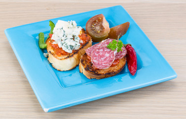 Tapas with cheese and salami