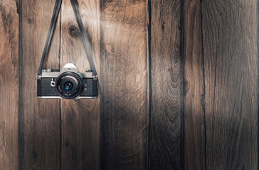 Old retro camera on vintage wooden planks