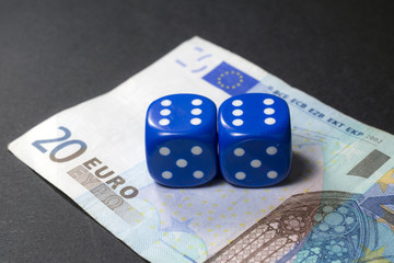 Gambling dice and twenty euros